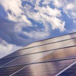 Solar panels converting sunlight into electricity on a residential rooftop.