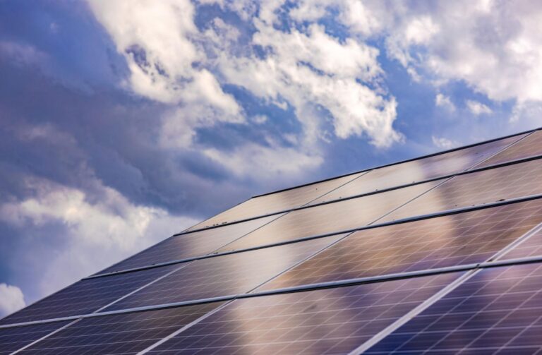 Solar panels converting sunlight into electricity on a residential rooftop.
