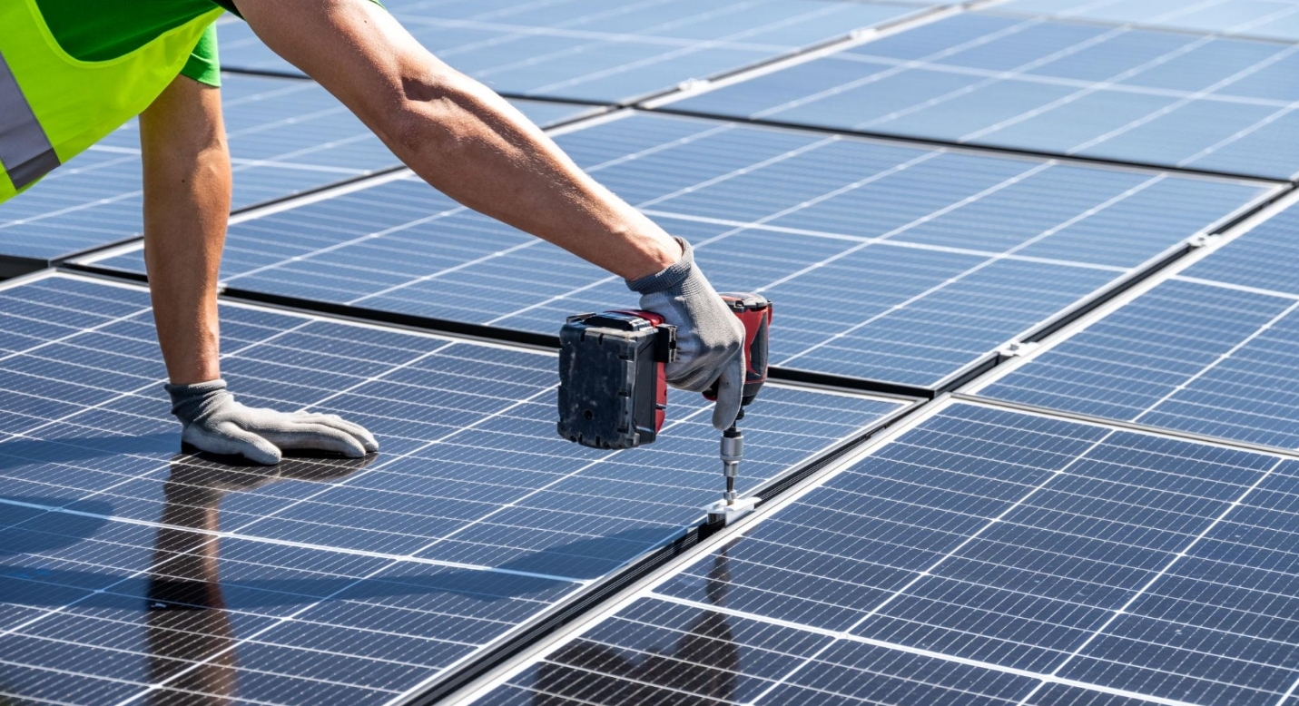 Solar panels converting sunlight into electricity on a residential rooftop.