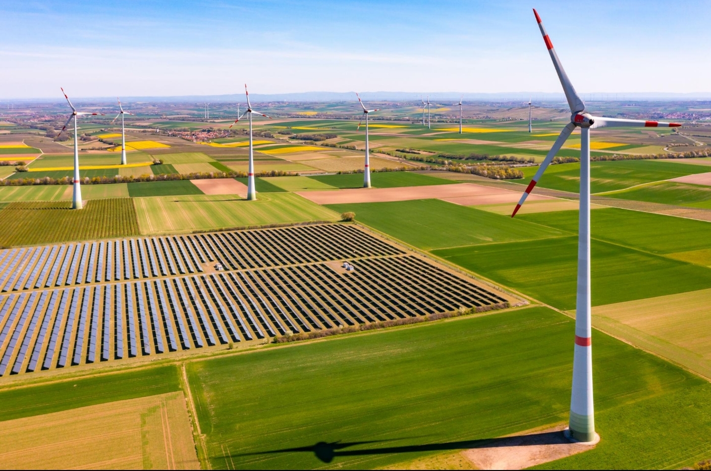 Solar panels installed across a European landscape representing the EU Green Deal's clean energy future